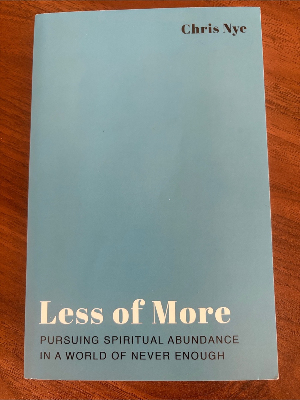 Less of More by Chris Nye - Light Blue Paperback Spiritual Book